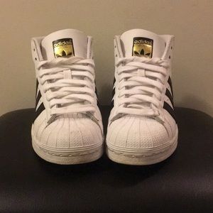 Boys adidas superstars.